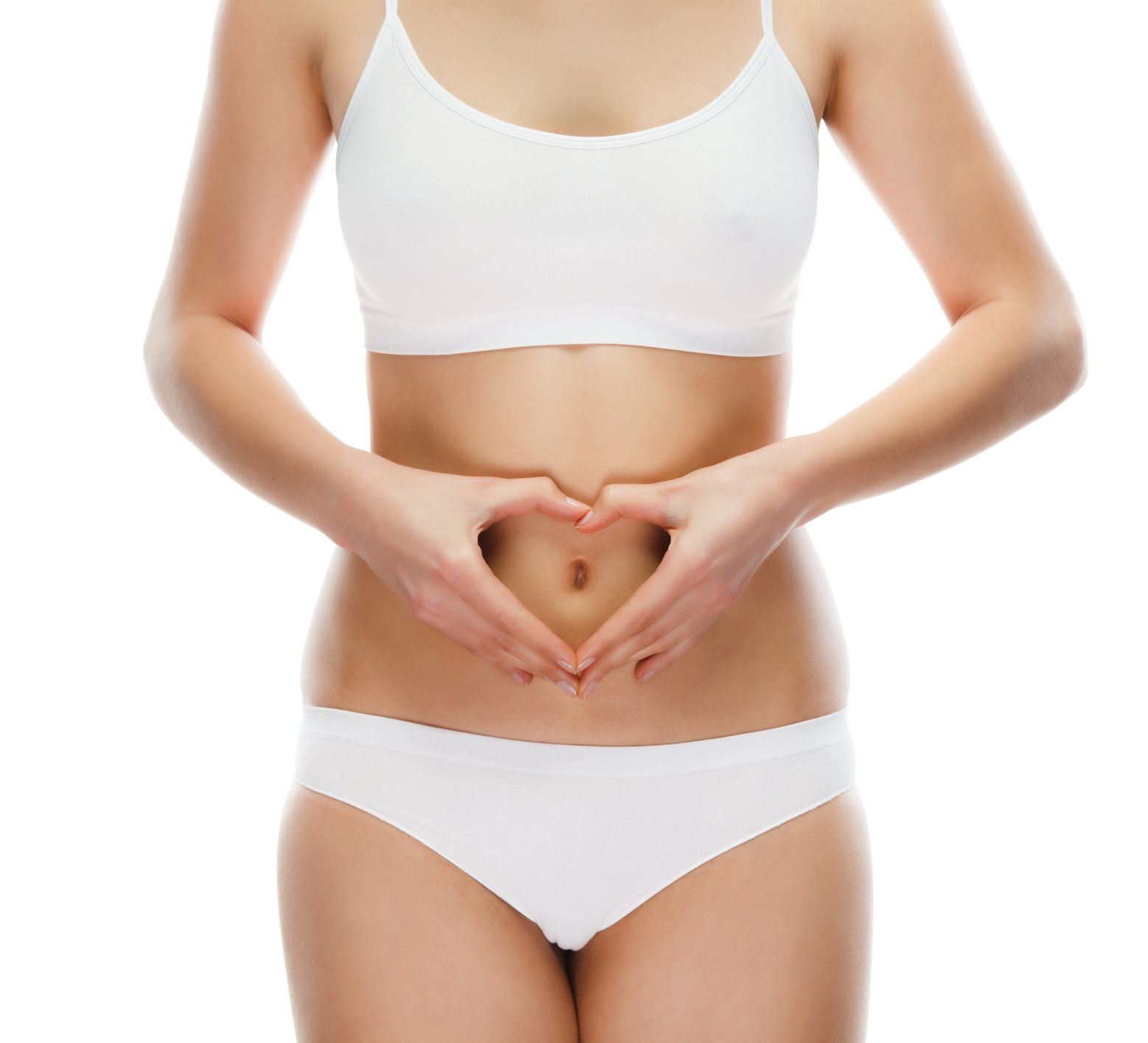 A woman making a heart shape with her hands on her stomach