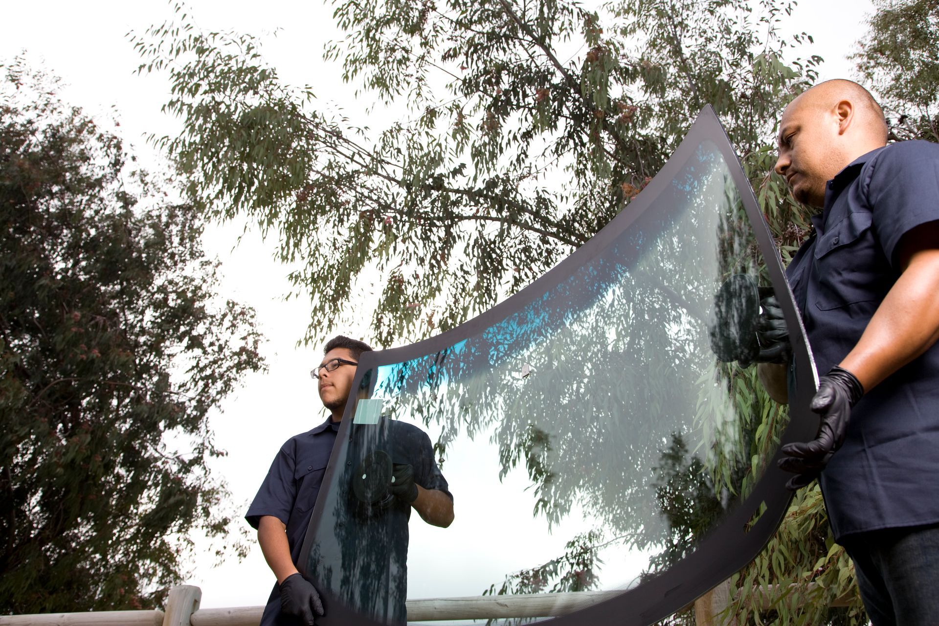Man Repairing and Replacing the Glass on a Car  - Redlands, CA - Alpha Auto Glass