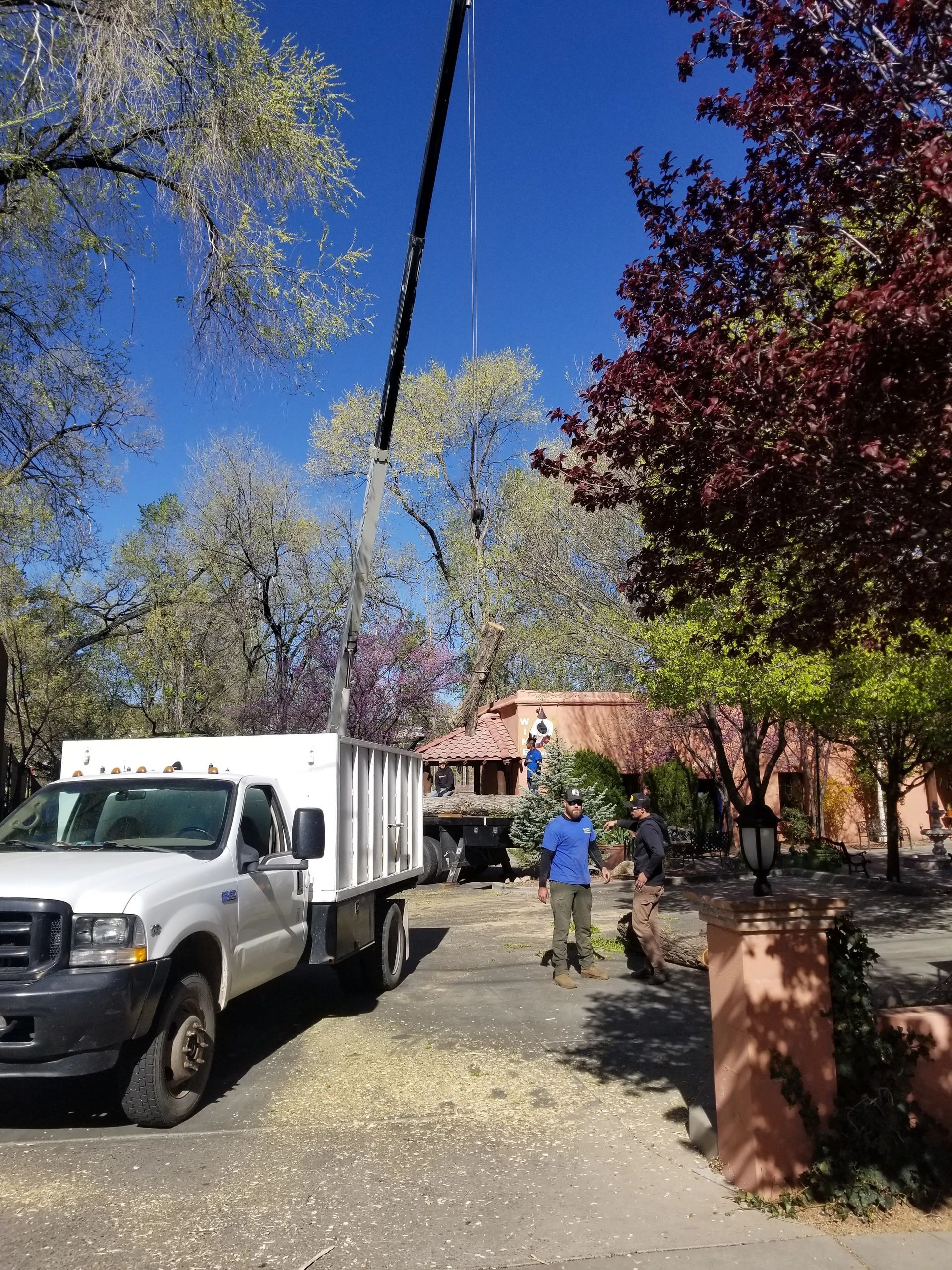A white truck is parked in front of a house