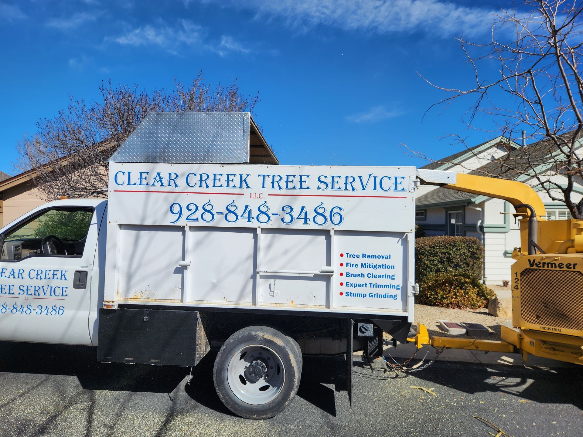 White truck with clear creek tree services signage