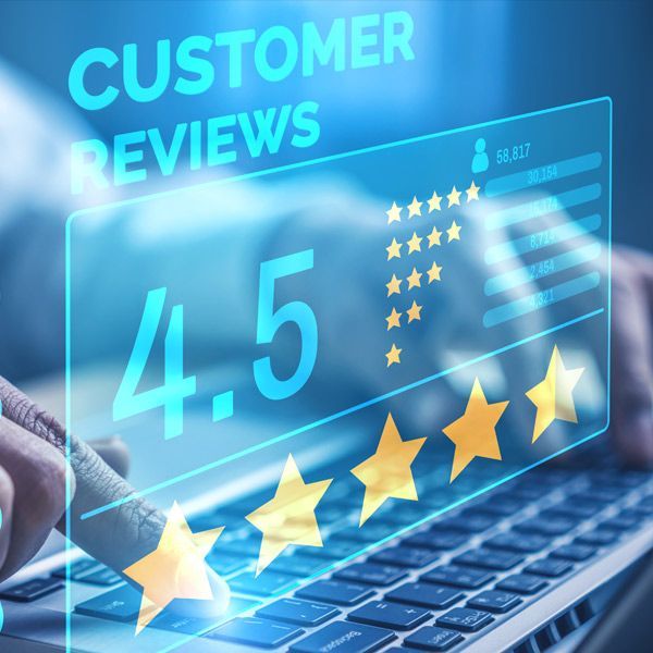 Person using a laptop, displaying customer reviews with a 4.5-star rating and gold stars Good Reputation Management