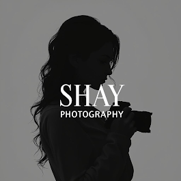 Silhouette of a photographer holding a camera, with “SHAY PHOTOGRAPHY” text overlay.