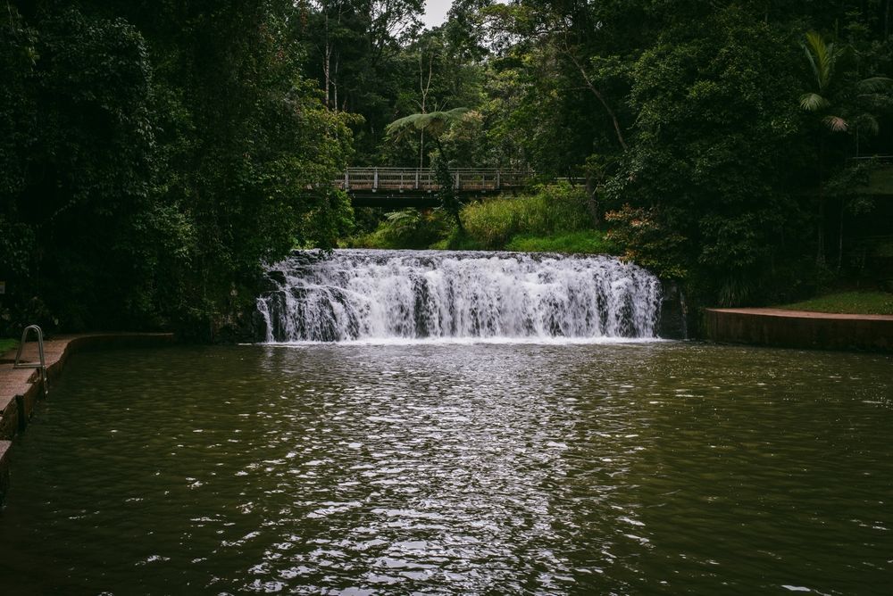 Waterfall Cascading Into a Dark Pond — Atherton Decor Centre In Malanda, QLD