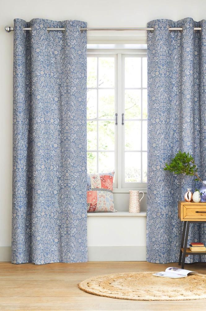 A Living Room With Blue Curtains and a Window — Atherton Decor Centre In Mareeba, QLD