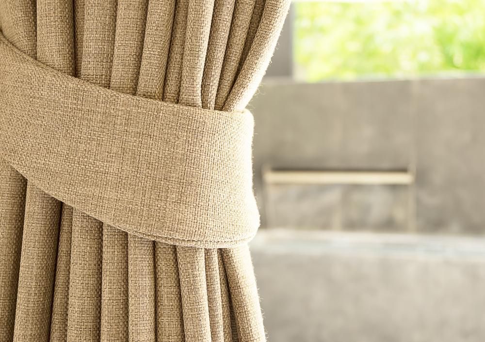 A Close Up of a Curtain With a Tie on It — Atherton Decor Centre In Atherton, QLD