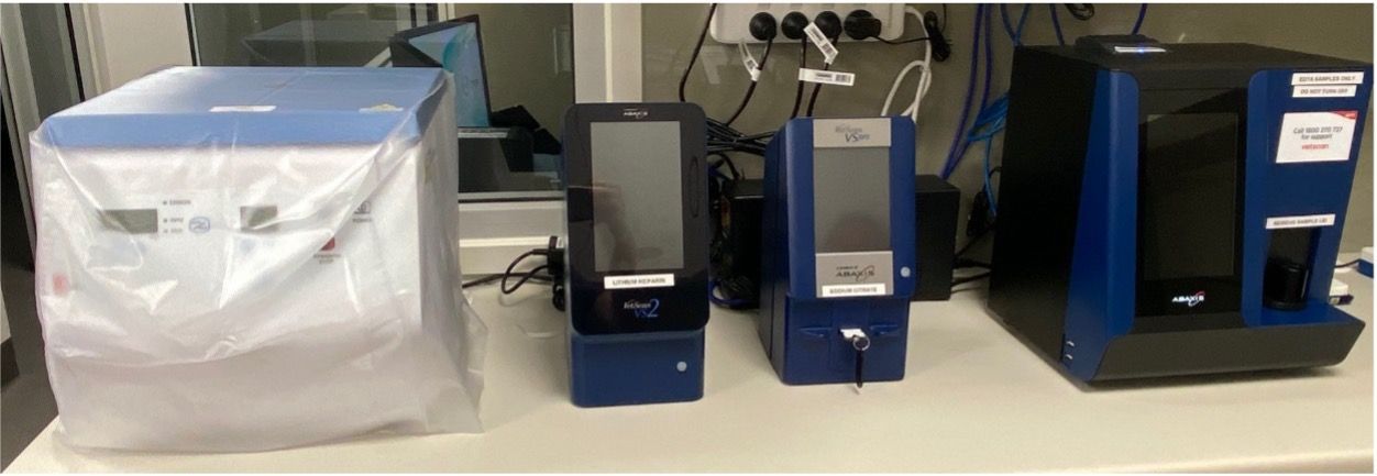 Countertop with laboratory machines: a covered white unit, two small black-blue devices, and a larger blue instrument. — Valley Vet Surgery In Walkerston, QLD
