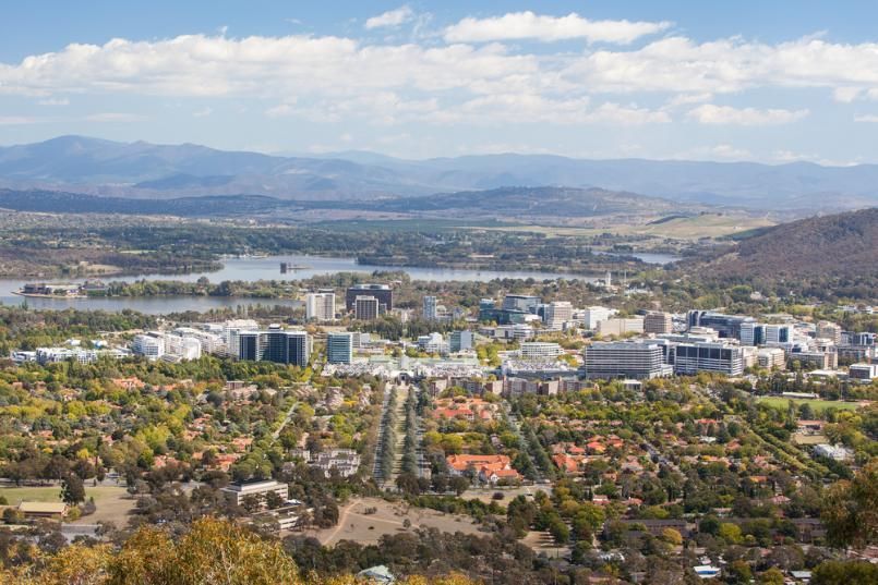 An Aerial View of a City With Mountains in the Background — Bonanno's Menswear in Engadine, NSW