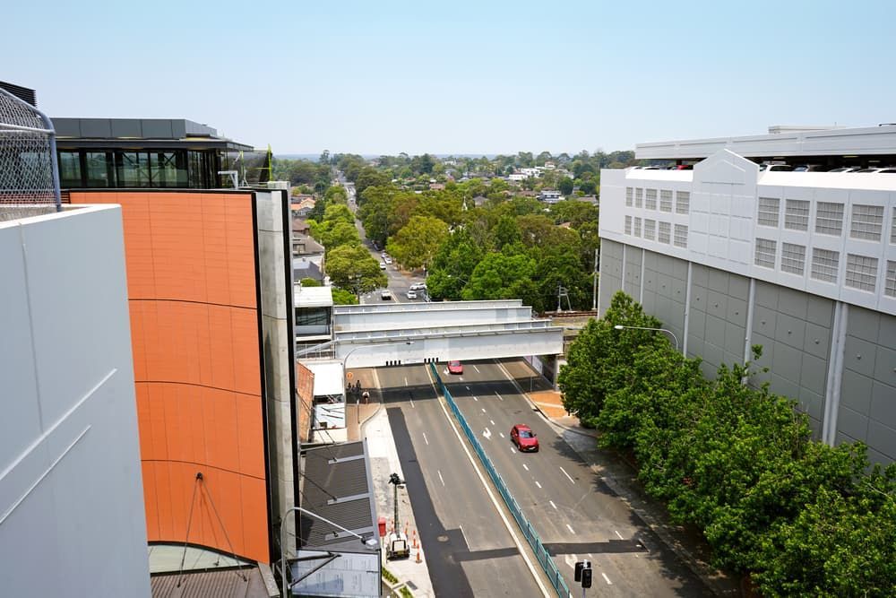 An Aerial View of a City Street With a Bridge Over It — Bonanno's Menswear in Sutherland, NSW