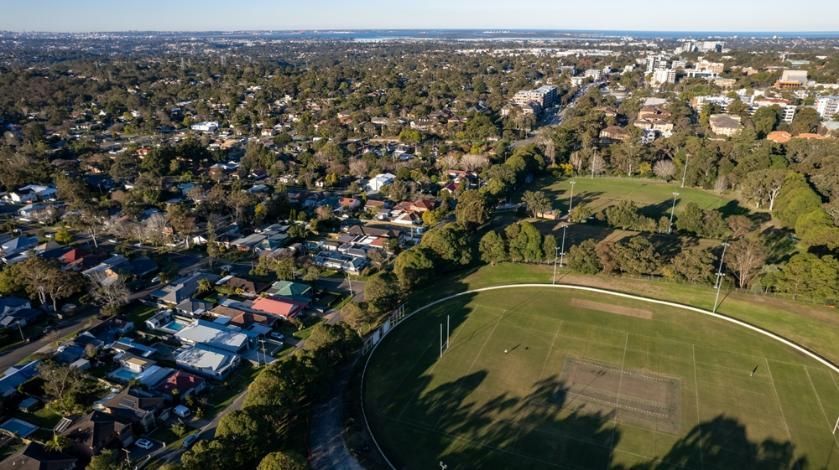 An Aerial View of a Residential Area With a Soccer Field in the Middle of It — Bonanno's Menswear in Sutherland, NSW