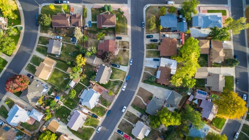 An Aerial View of a Residential Neighborhood With Lots of Houses and Trees — Bonanno's Menswear in Engadine, NSW