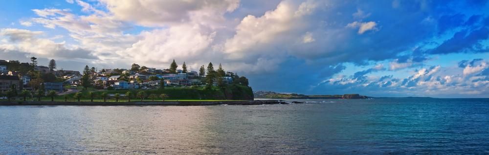A Large Body of Water With a Small Island in the Middle of It — Bonanno's Menswear in Kiama, NSW
