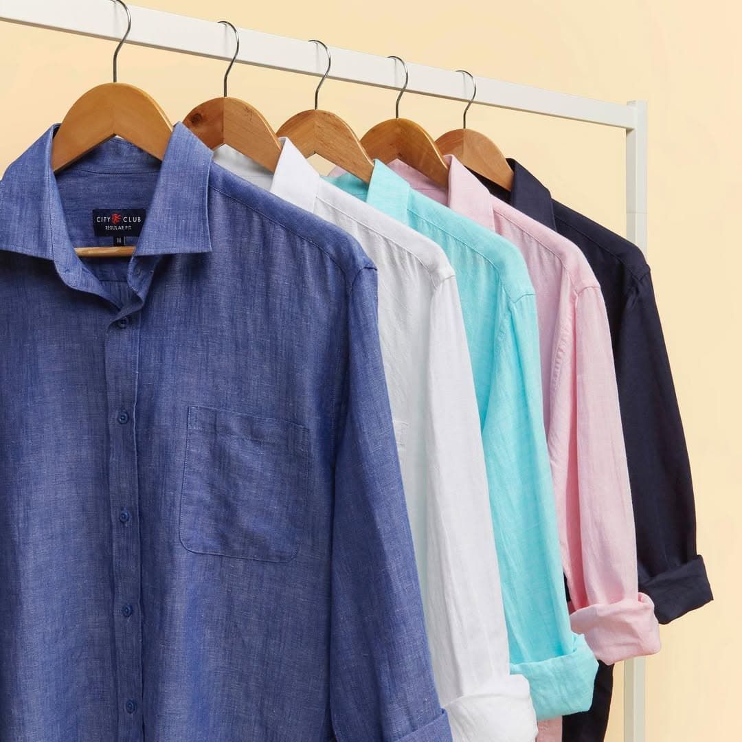 A Bunch of Shirts Are Hanging on a Rack — Bonanno's Menswear in Shellharbour, NSW