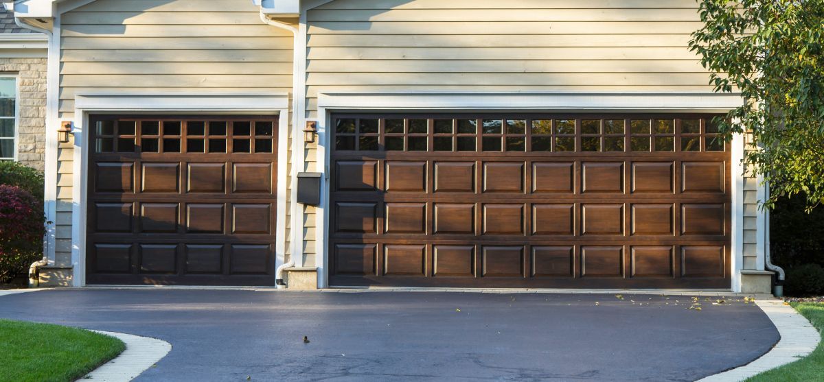 Comparing Garage Door Materials: Wood, Steel, Aluminum, Fiberglass
