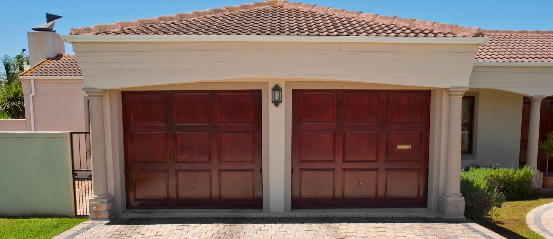 A white house with a red garage door