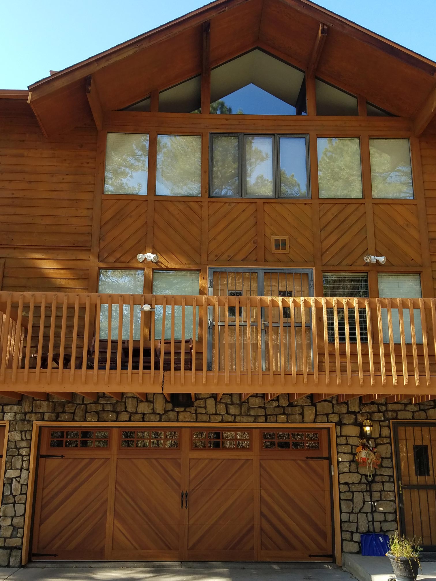 A large wooden house with a large balcony