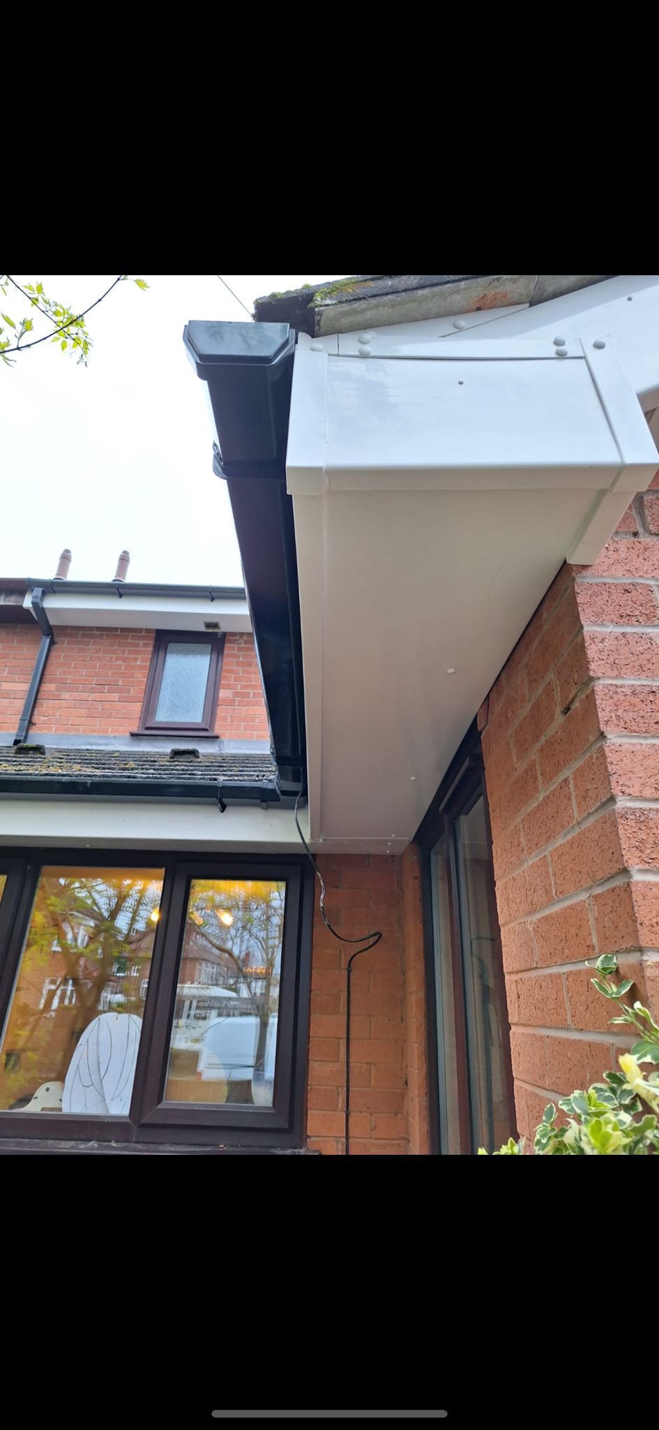 a picture of new fascias soffits and gutters on a property installed by Manchester roofing repairs