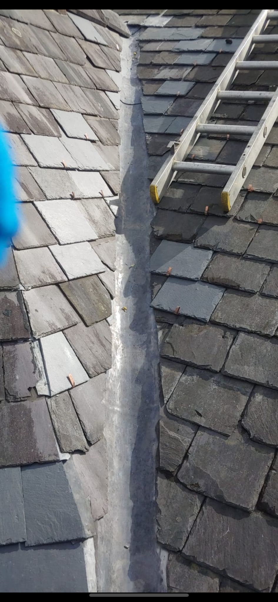 A picture of the Manchester Roofing Repairs Team carrying out  a Slate Roof Repair