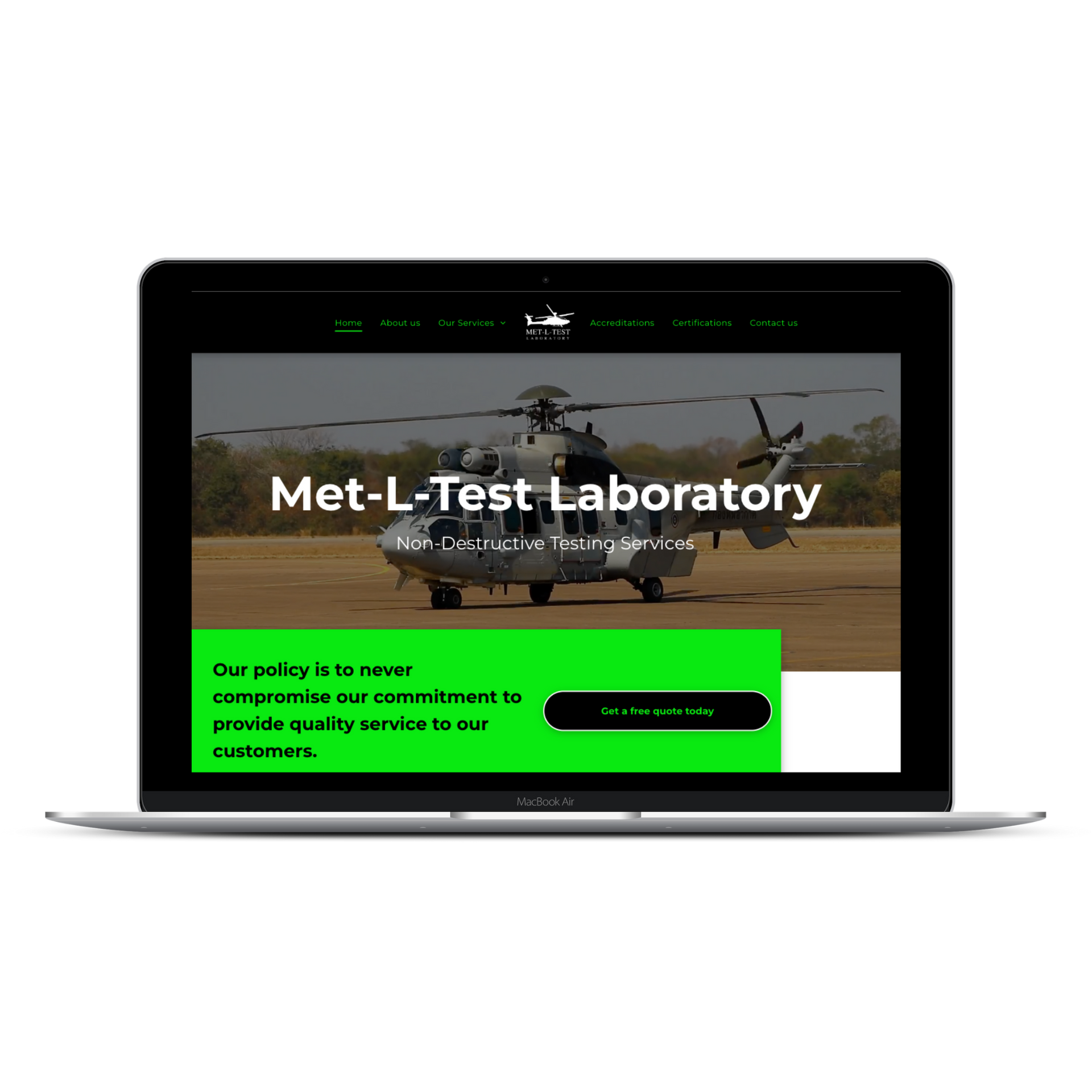 A laptop display shows the Met-L-Test Laboratory website featuring a helicopter on a brown field against a green background.