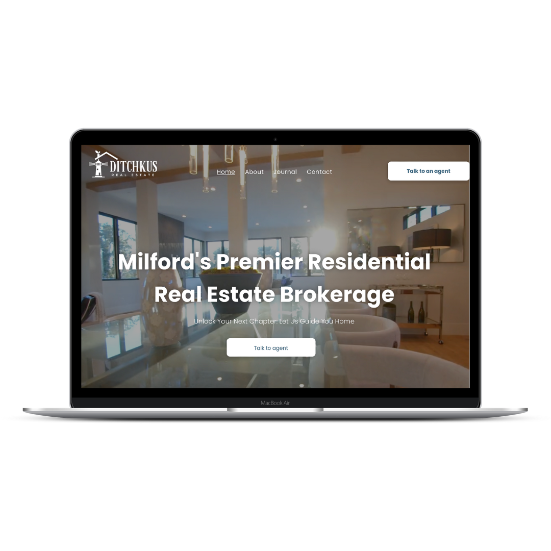Laptop screen displaying the website homepage for LeFevre Real Estate, featuring the text 