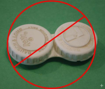 A dirty contact lens case with a red circle around it