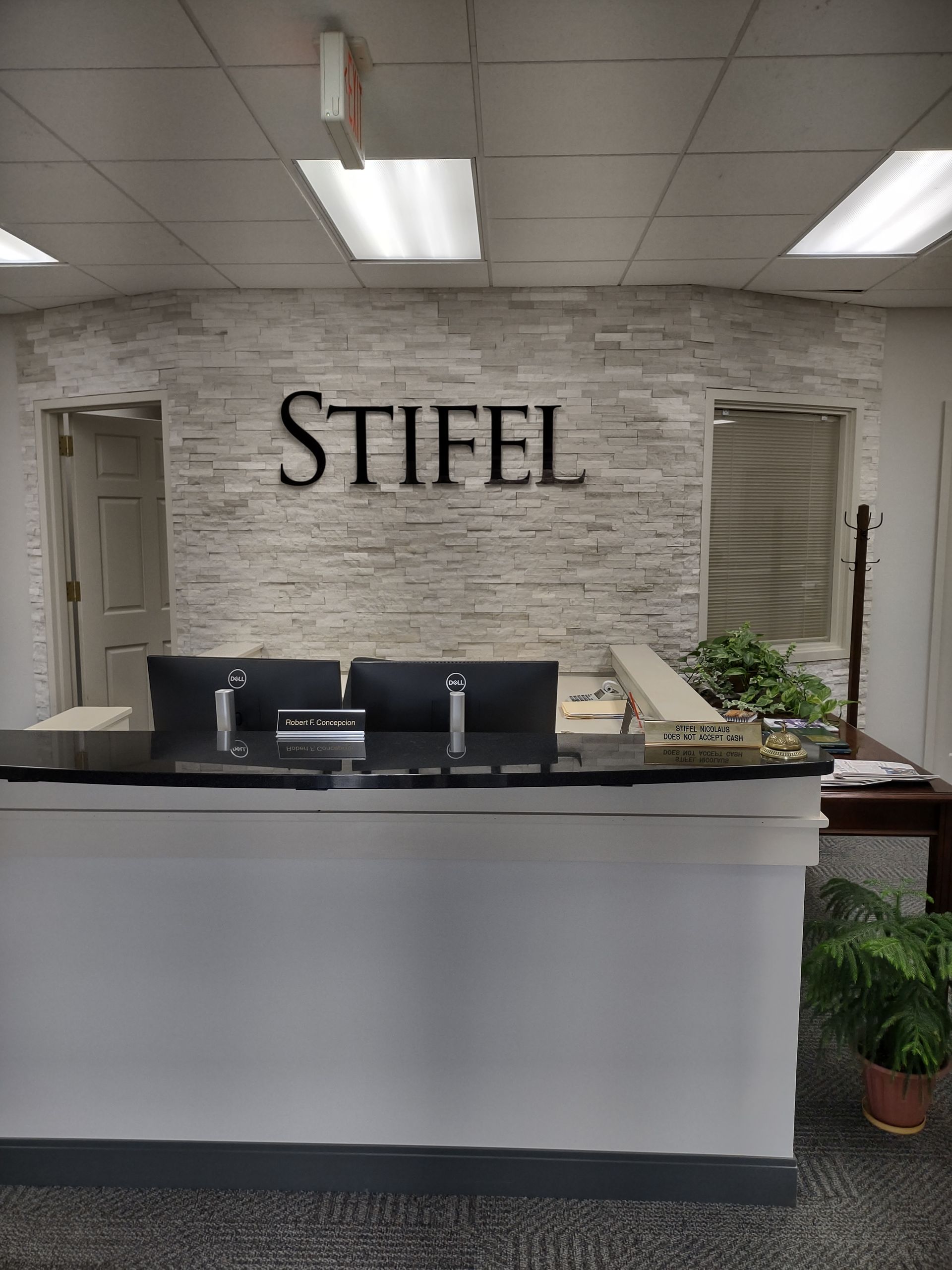 A reception desk with a sign above it that says stiefel.