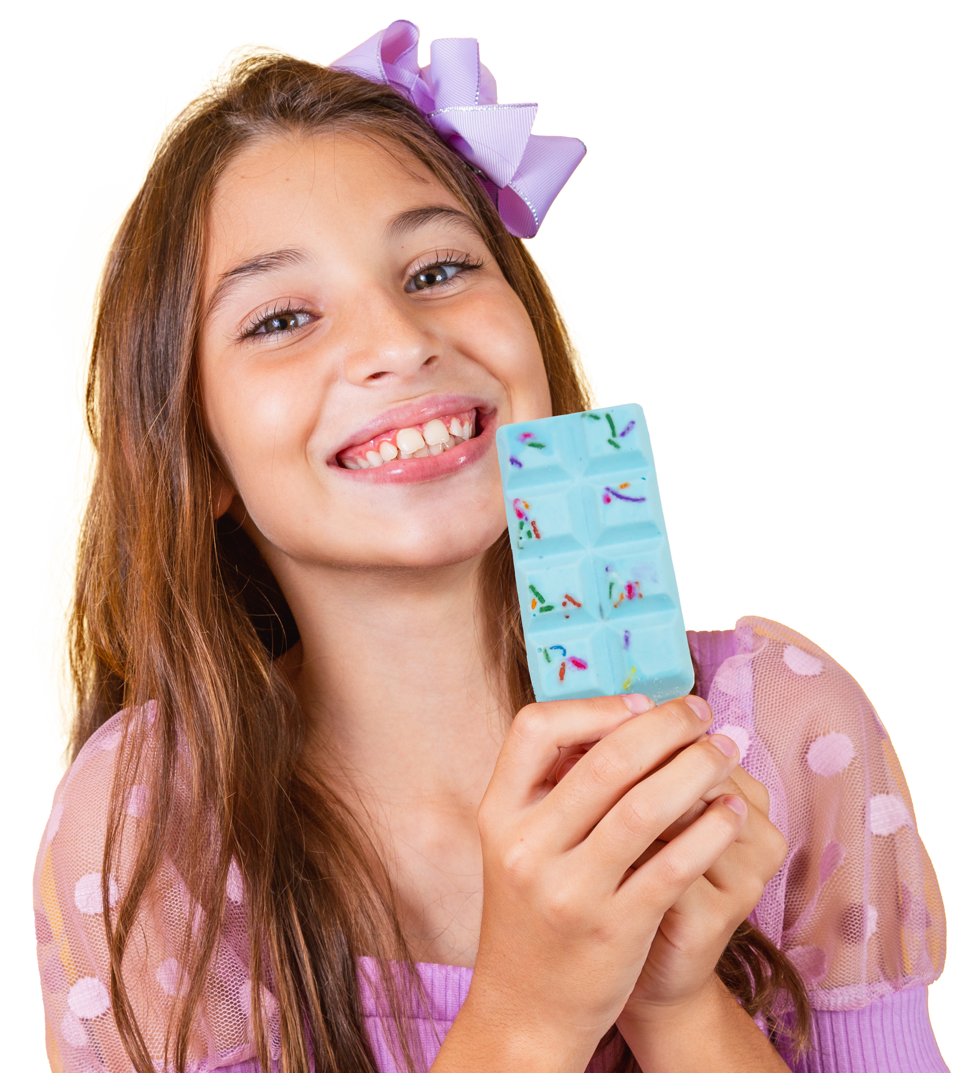 A girl with a purple bow in her hair is holding a bar of chocolate