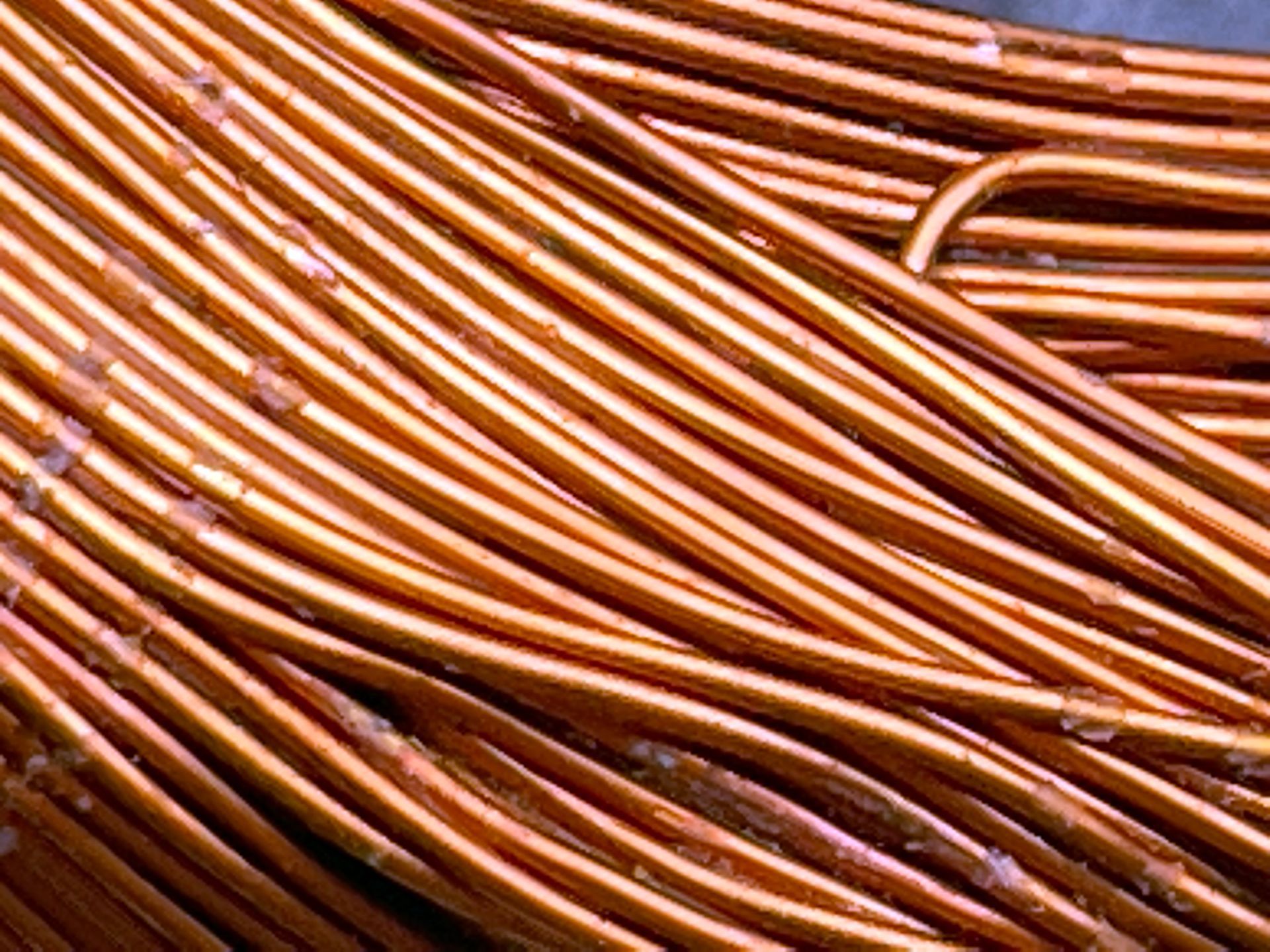 A close up of a bunch of copper wires on a table.