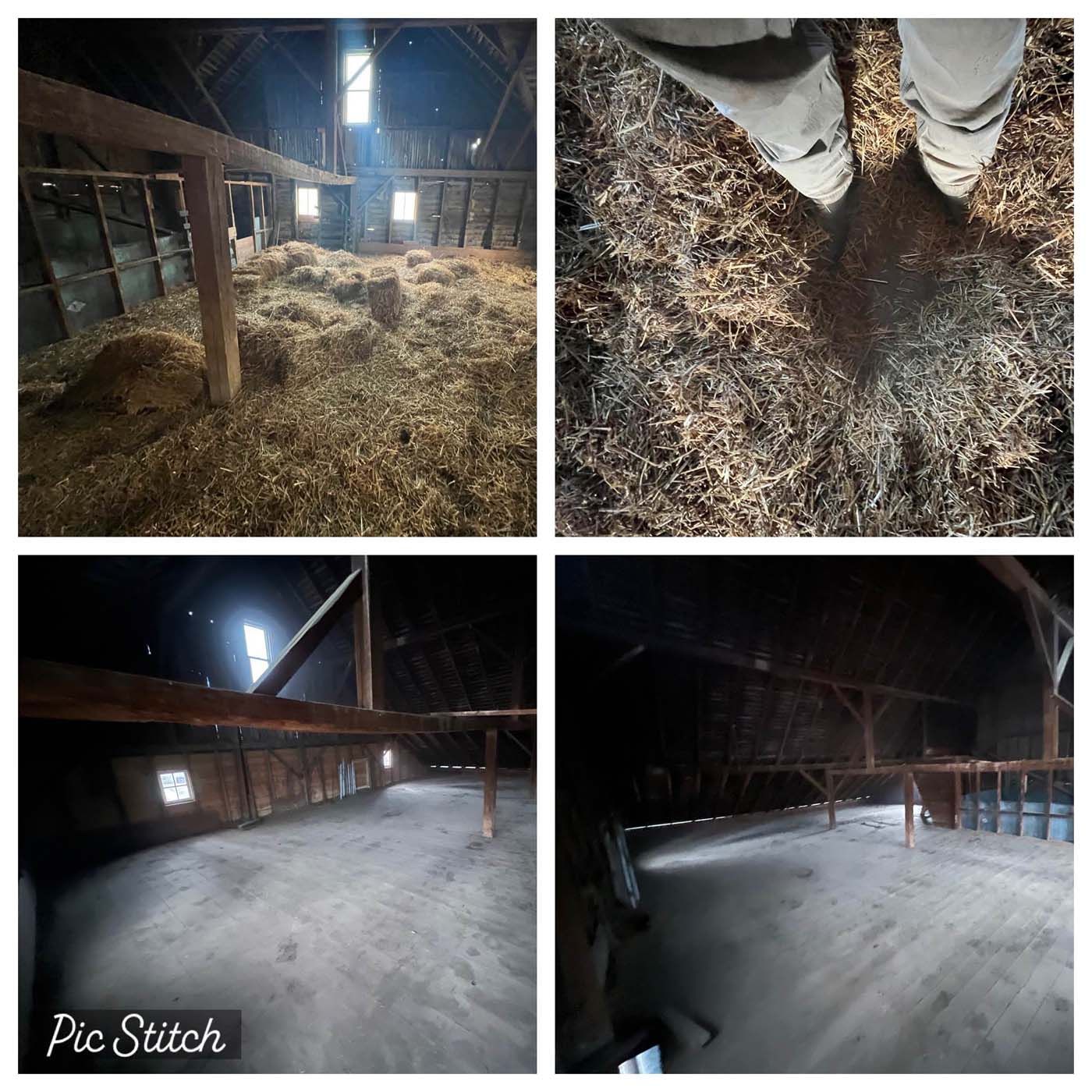 Barn interior. Hay and straw on floor. Sunlight streams in. Person's feet in boots. Empty space, wood beams.