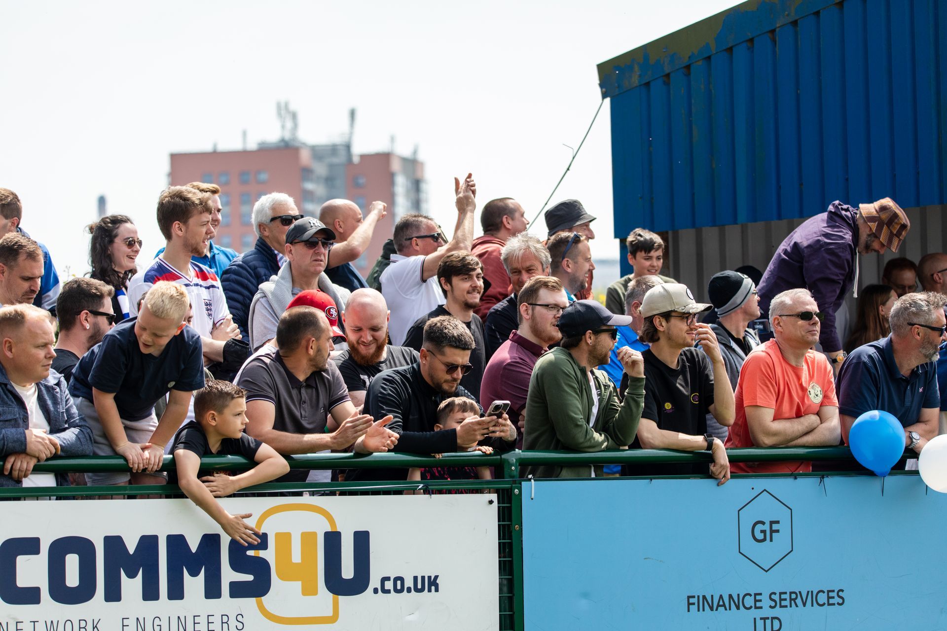 Oxford City Supporters cheer on the team from the stands supplied by That Event Company & erected by KMC Scaffolding