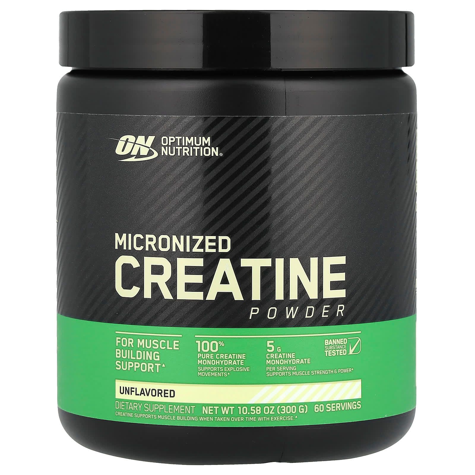 Envase negro de creatina micronizada en polvo con etiqueta verde y tapa negra.