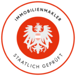 Ein roter Kreis mit einem weißen Adler in der Mitte.