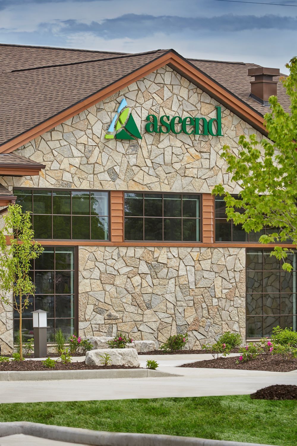 A large stone building with the word ascend on it