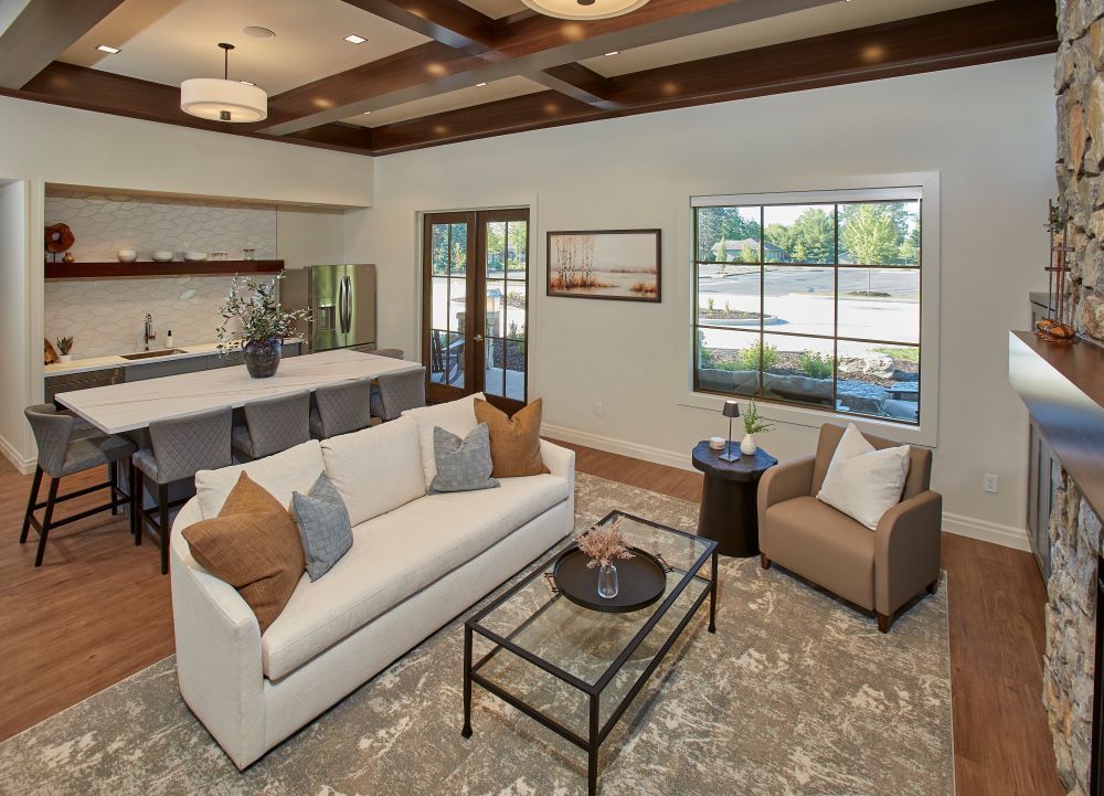 A living room with a couch , chairs and a coffee table