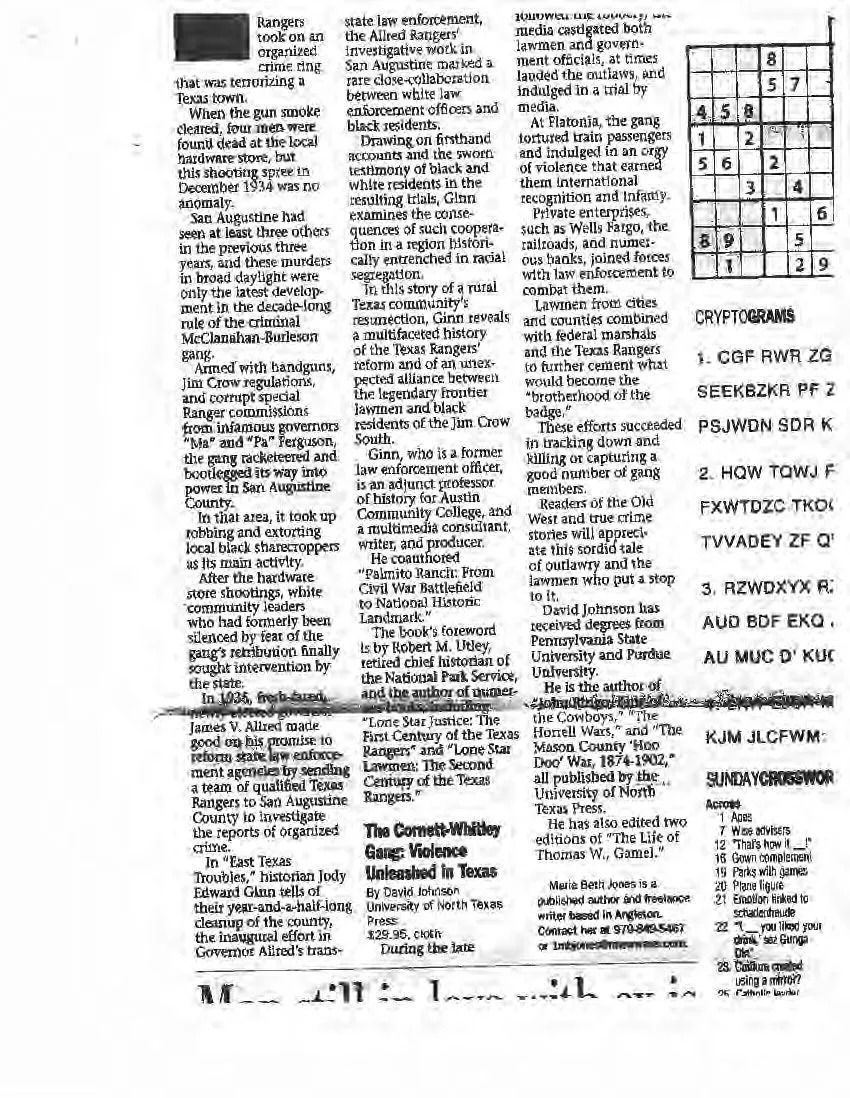 Blurry black-and-white newspaper page with dense text columns and a small chart on the right