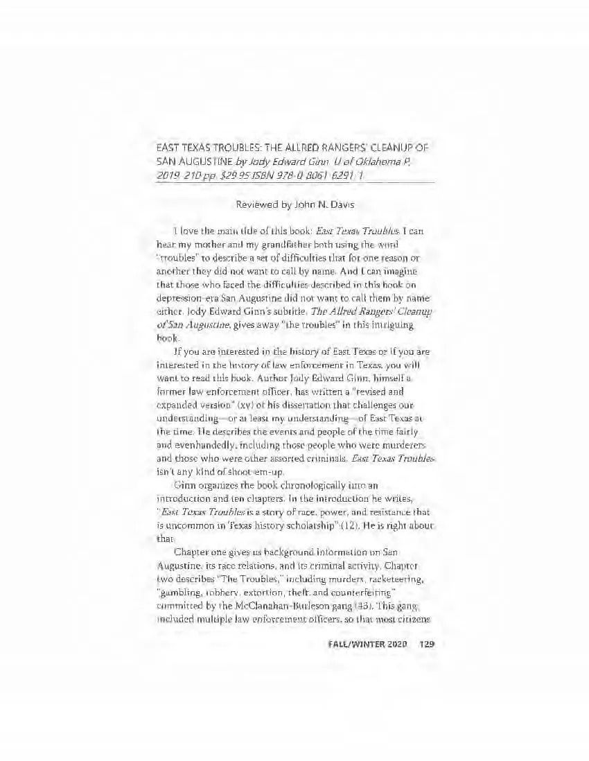 Blurry photo of a text-heavy printed document page on a white background.