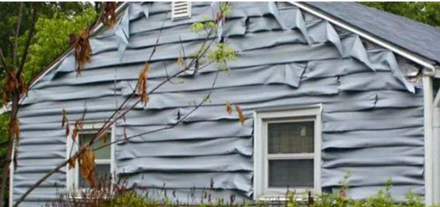 A photo of vinyl siding that has melted