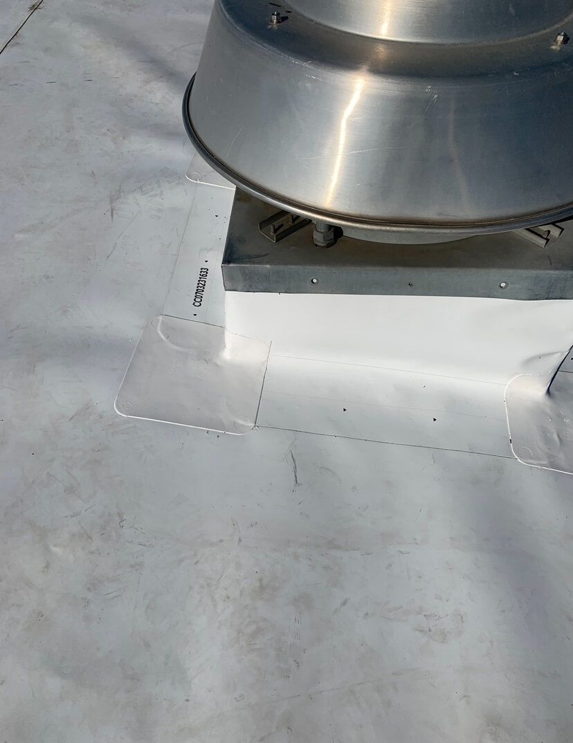 Close-up detail of vent flashing on a TPO roof at Decco USA in Yakima, installed by Yakima Roofing & Remodeling.