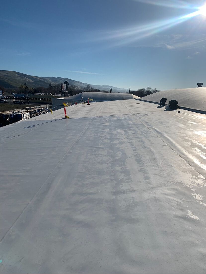 Wide-angle view of completed TPO roofing system at Decco USA in Yakima, installed by Yakima Roofing & Remodeling.