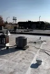 Finished TPO roof at Labcorp Yakima, showing smooth and seamless membrane installation.