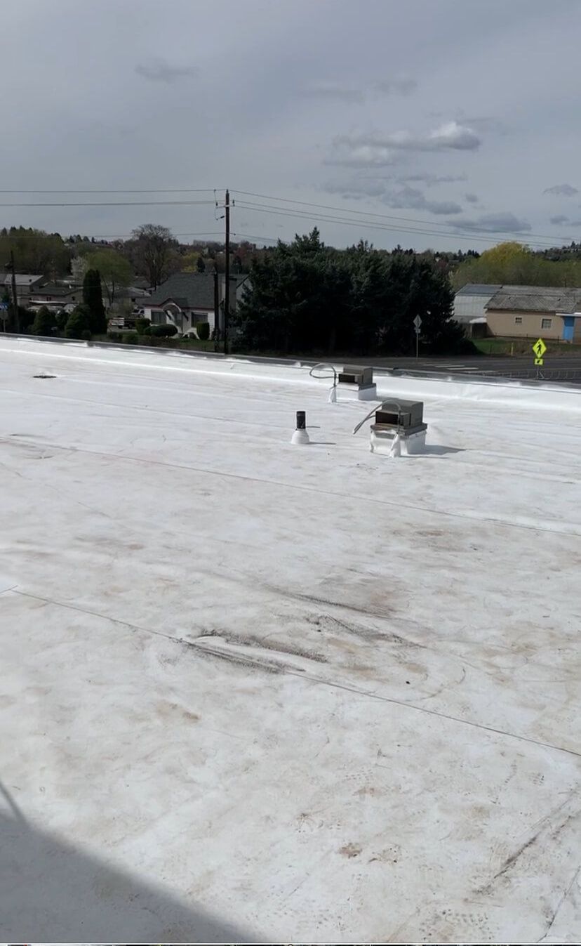 Wide view of the TPO membrane in progress at Syntec US, with roof fixtures visible.