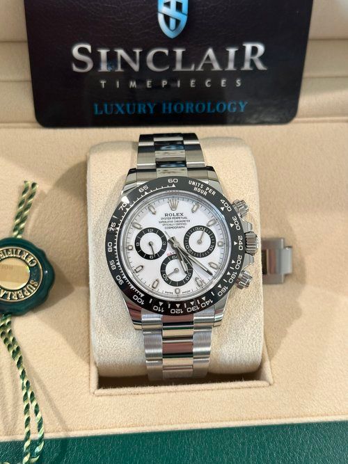 A rolex watch is in a sinclair box
