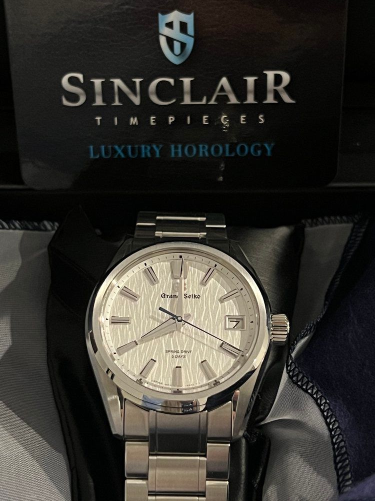 A sinclair timepieces luxury hobology watch in a box