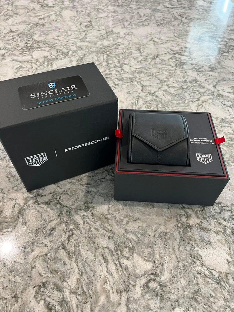 A watch box is sitting on top of a counter.