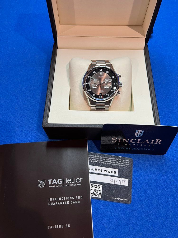 A tag heuer watch is sitting in a box