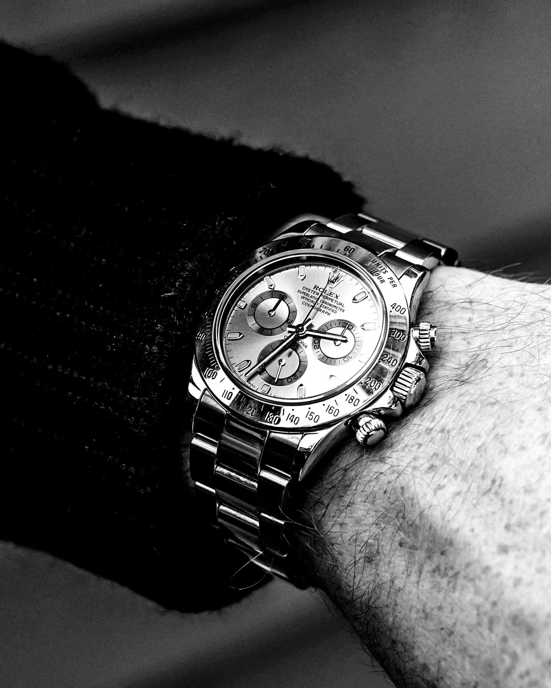 A man wearing a rolex watch on his wrist