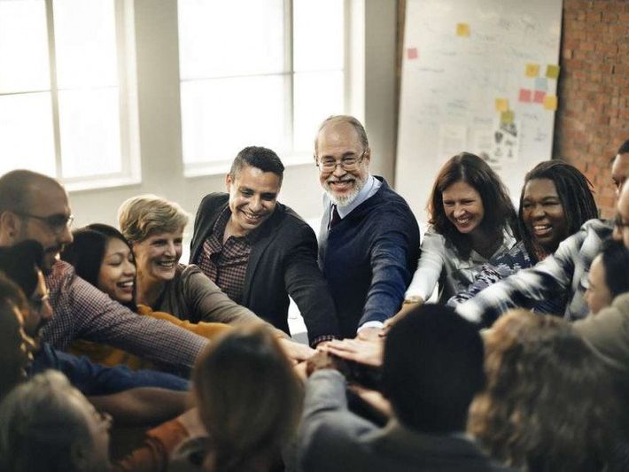 employees huddling