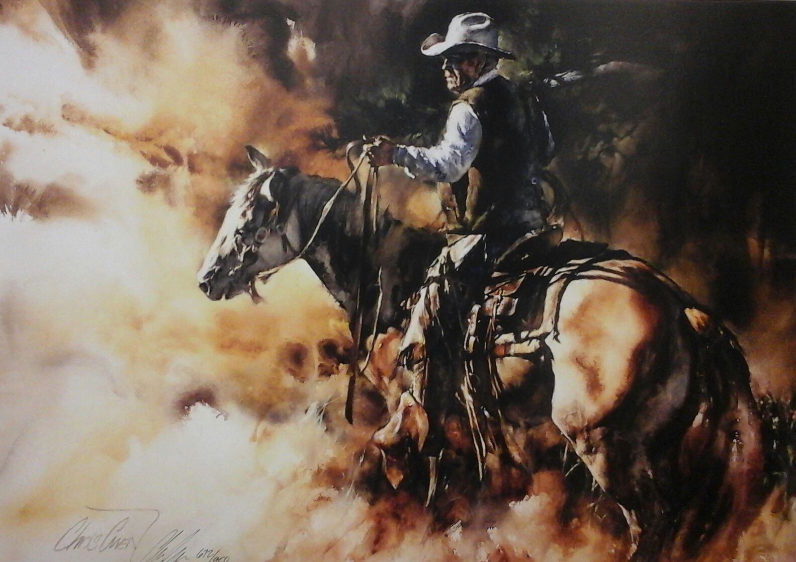A man in a cowboy hat is riding a horse