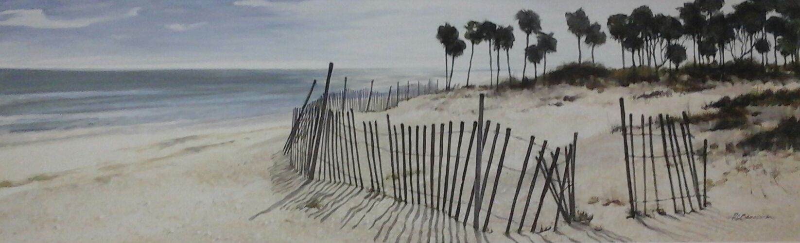 A black and white photo of a beach with a fence and palm trees.