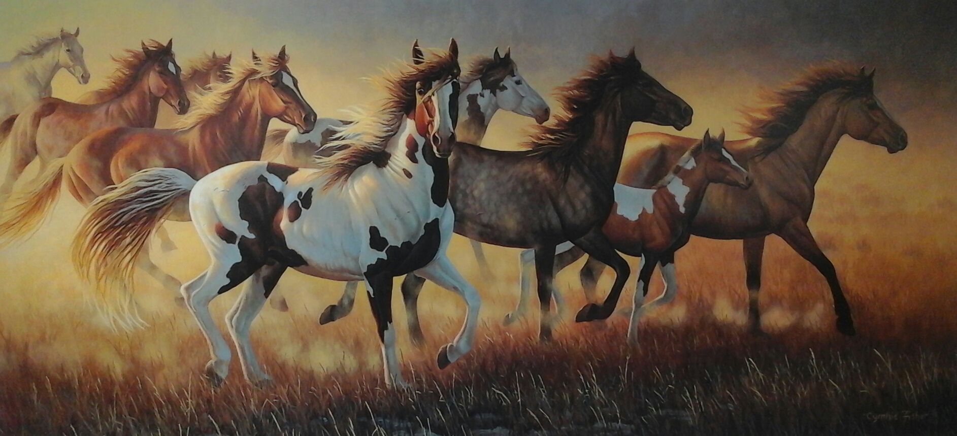 A painting of a herd of horses running in a field