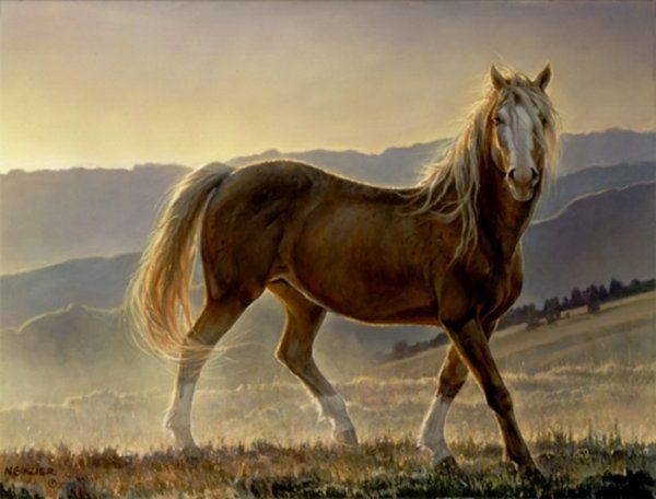 A brown horse is walking in a field with mountains in the background.